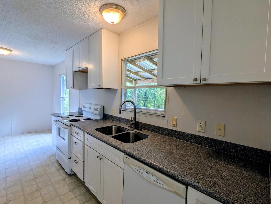 3335 Daniels Run Road Northeast Check, VA 24072 - Photo 11 of 23 a kitchen with granite countertop a sink and a stove