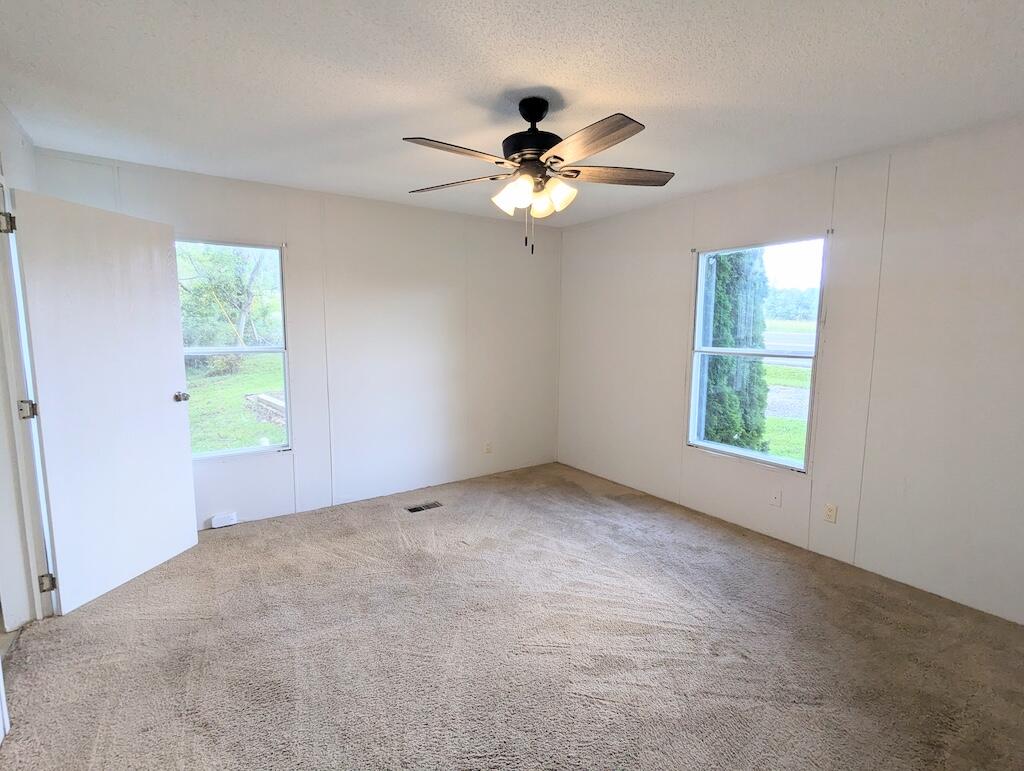 3335 Daniels Run Road Northeast Check, VA 24072 - Photo 18 of 23 an empty room with windows and fan