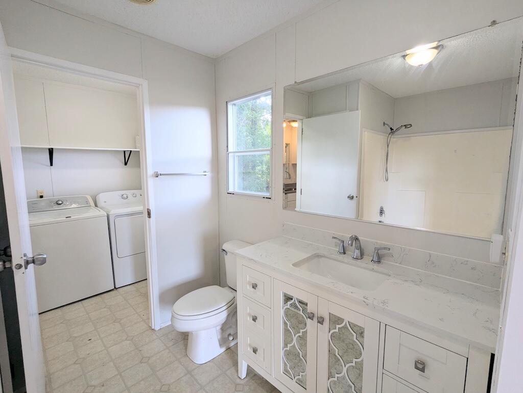 3335 Daniels Run Road Northeast Check, VA 24072 - Photo 19 of 23 a bathroom with a granite countertop sink a toilet and a mirror