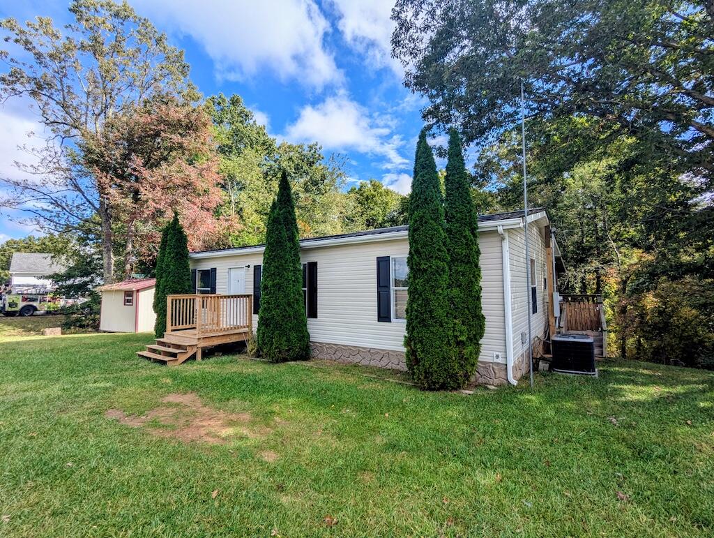 3335 Daniels Run Road Northeast Check, VA 24072 - Photo 7 of 23 a front view of a house with garden