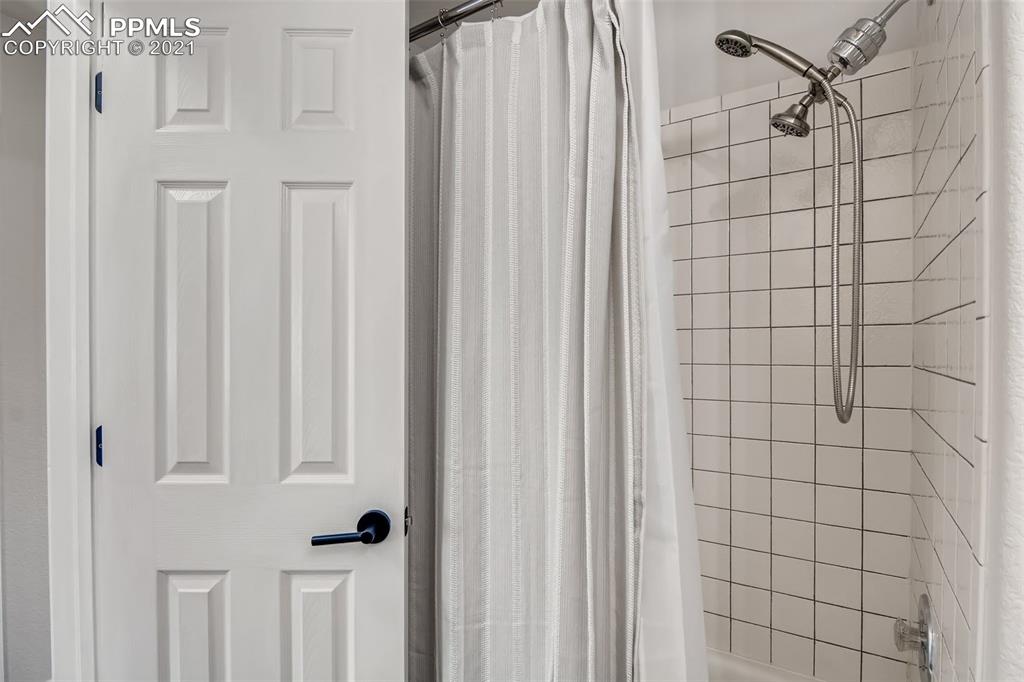 7330 Julynn Road Colorado Springs, CO 80919 - Photo 24 of 28 a bathroom with a shower