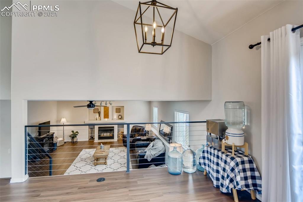 7330 Julynn Road Colorado Springs, CO 80919 - Photo 9 of 28 a living room with furniture and a wooden floor