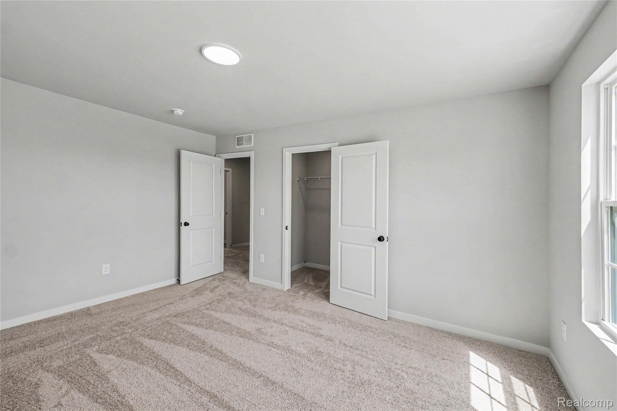 6030 Lahring Road Linden, MI 48451 - Photo 18 of 36 Second floor bedroom 4 features a walk in closet