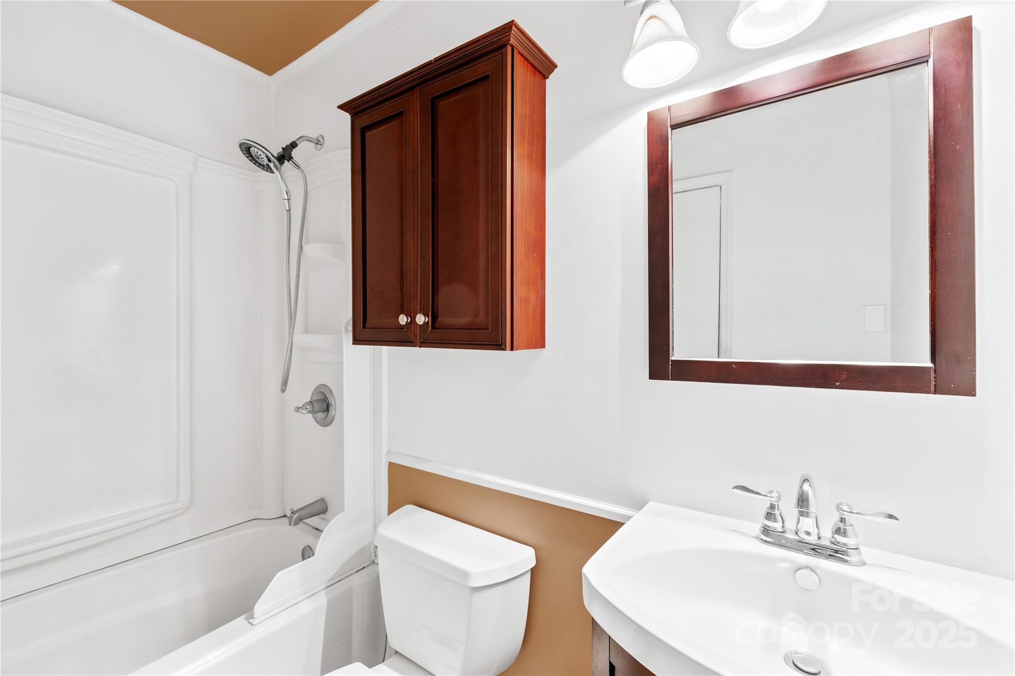 1208 Stallings Road Matthews, NC 28104 - Photo 11 of 18 a bathroom with a sink toilet and shower