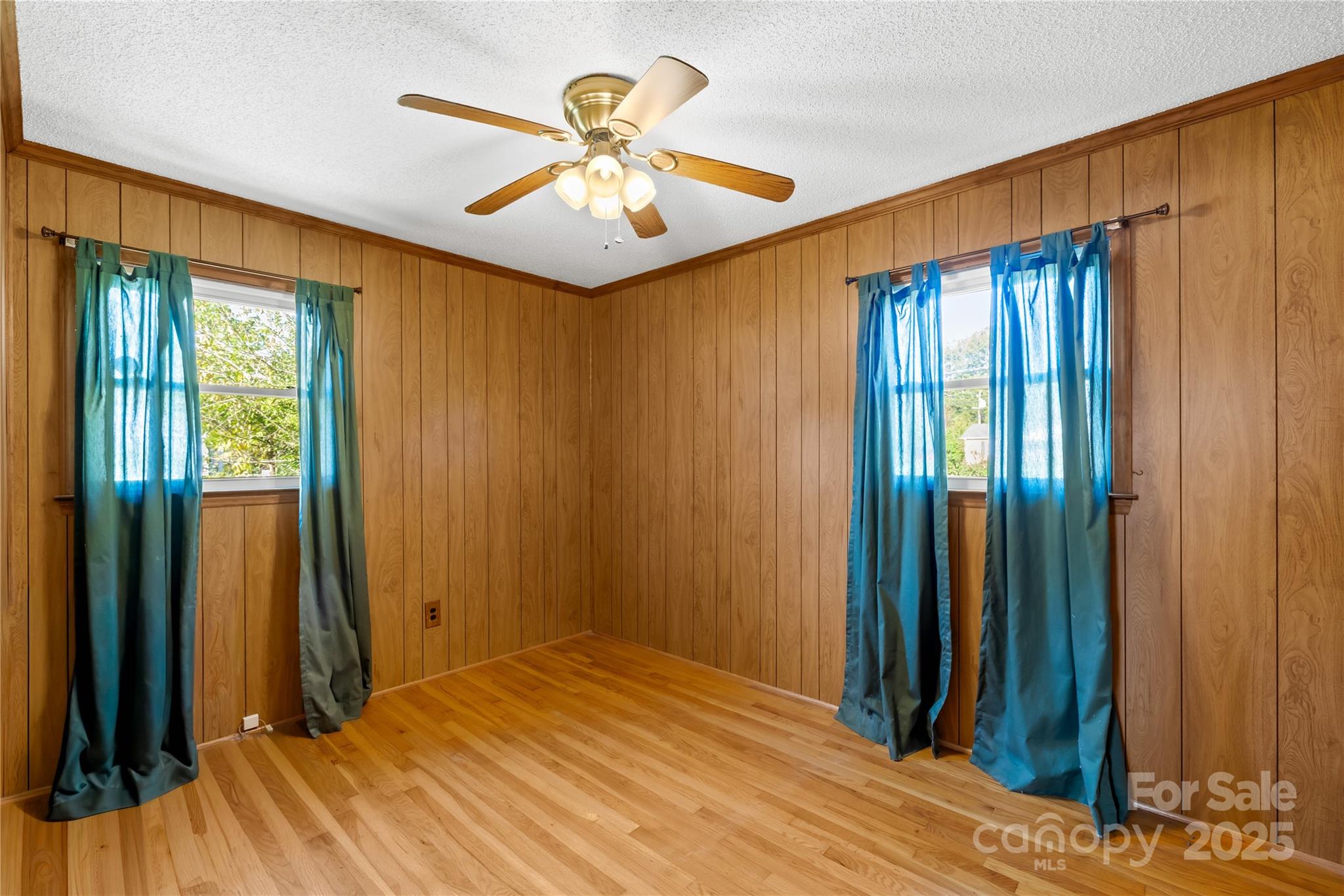 1208 Stallings Road Matthews, NC 28104 - Photo 12 of 18 a view of a room with a large bed and a chandelier