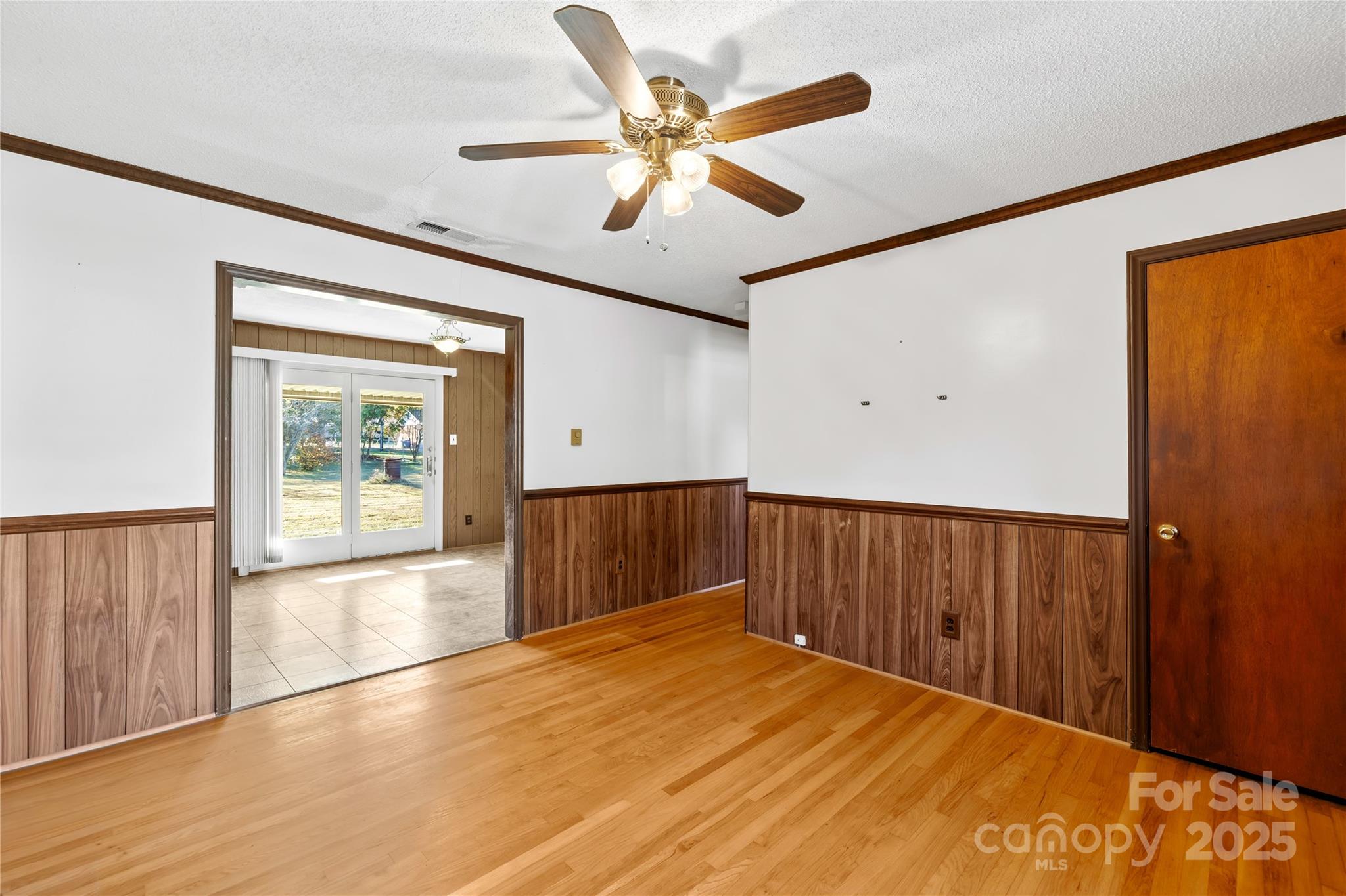 1208 Stallings Road Matthews, NC 28104 - Photo 14 of 18 a view of an empty room with wooden floor and a window
