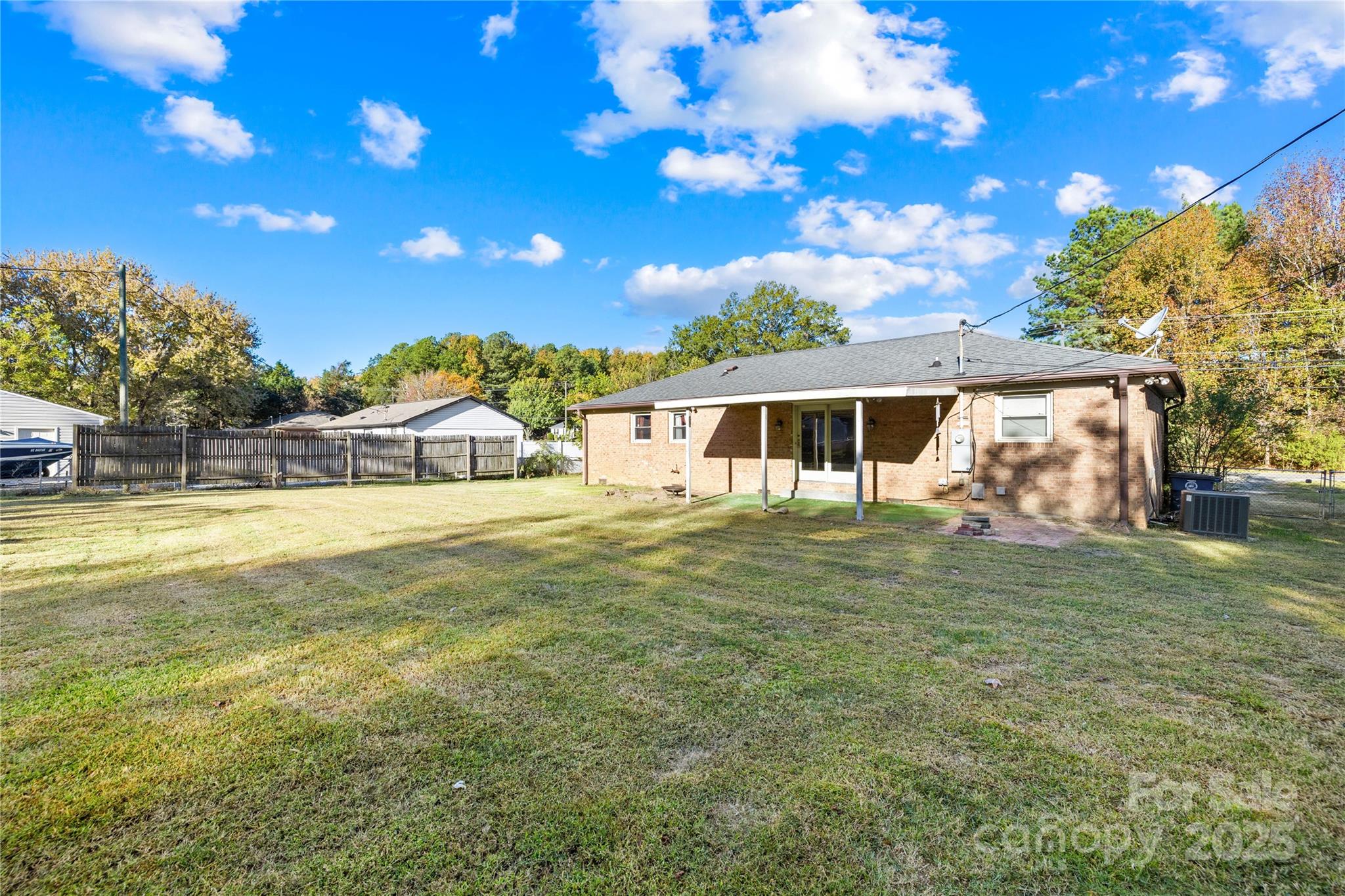 1208 Stallings Road Matthews, NC 28104 - Photo 4 of 18 a view of a house with a backyard porch and sitting area