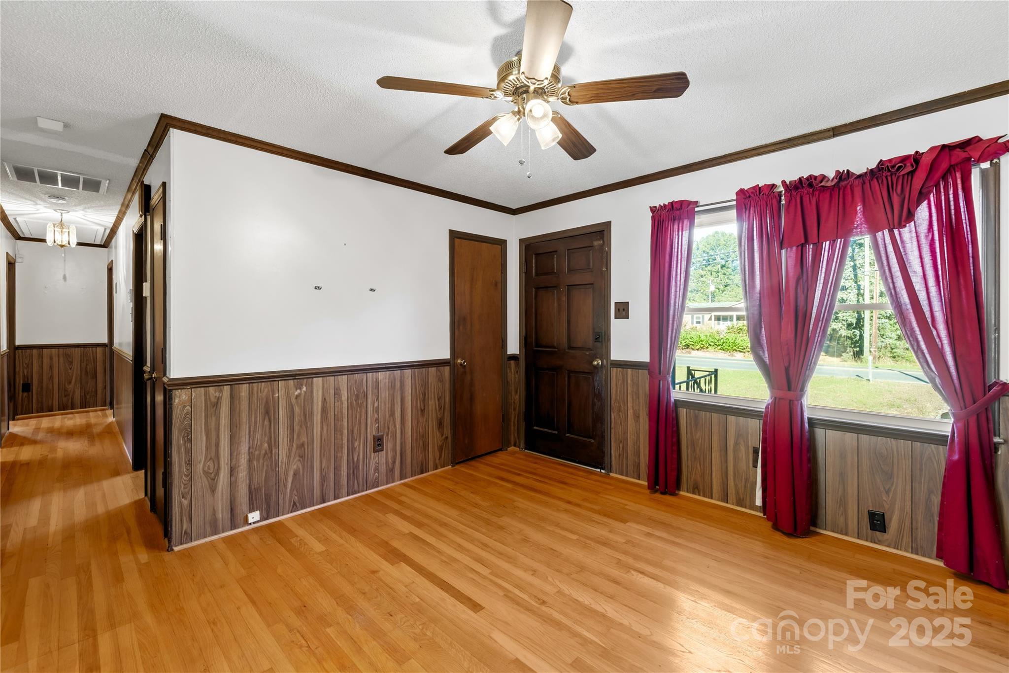 1208 Stallings Road Matthews, NC 28104 - Photo 9 of 18 a very nice looking room with a large window and a chandelier