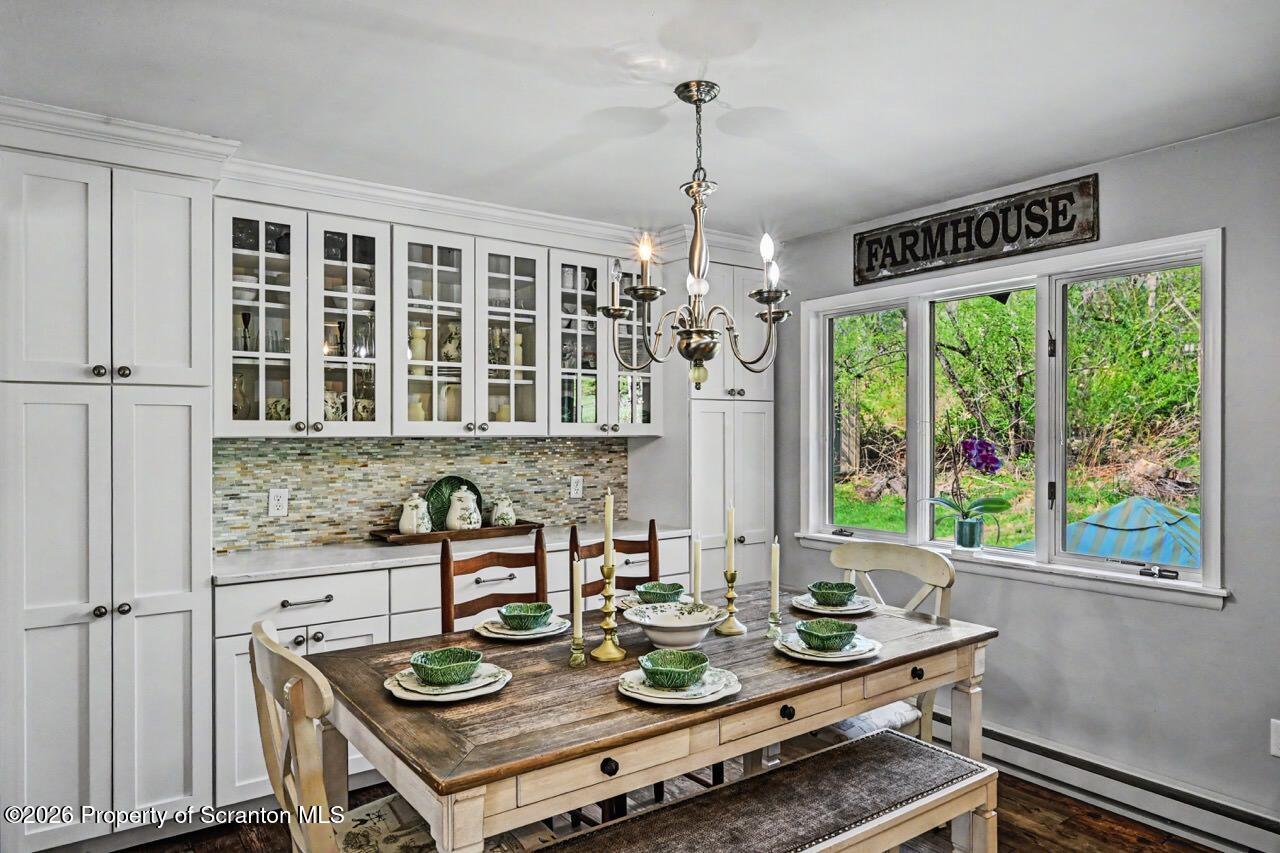 719 Scott Road Clarks Summit, PA 18411 - Photo 14 of 51 a view of a dining room with furniture window and outside view