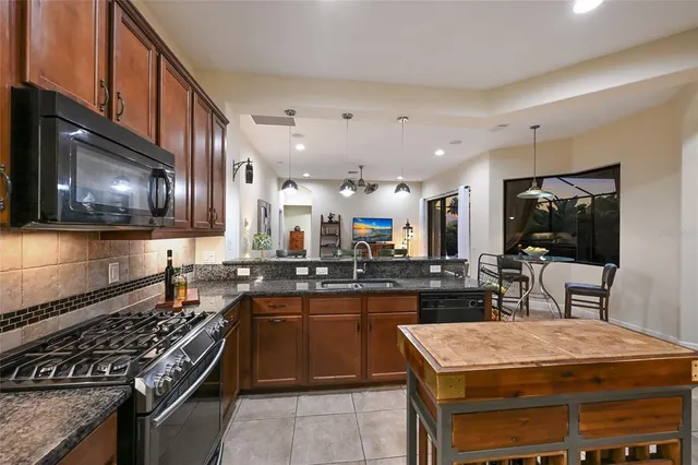 a kitchen with a stove and a microwave
