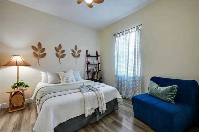 a bedroom with a bed and a couch