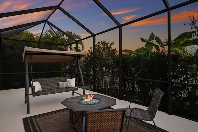 a patio with table and chairs