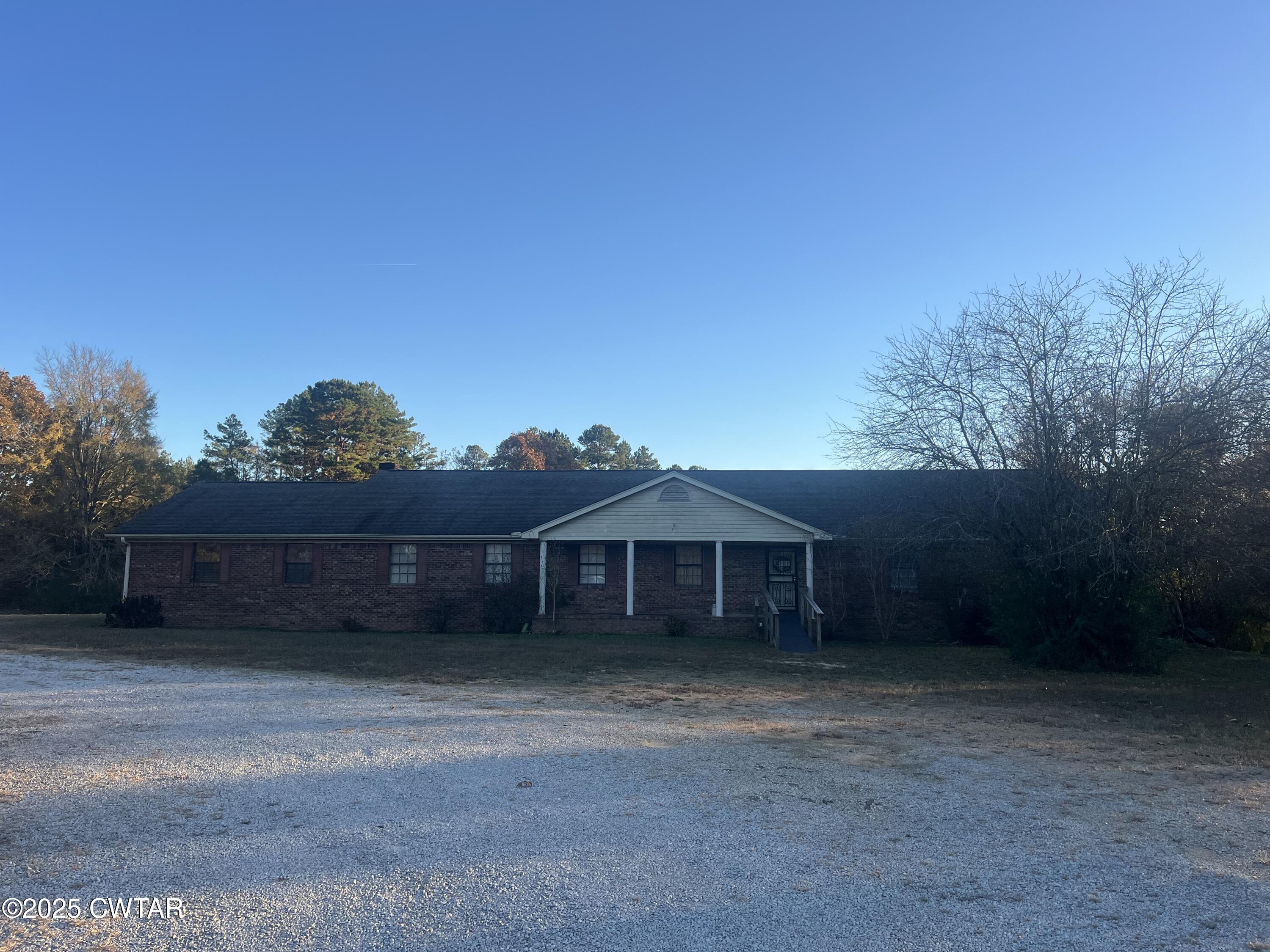 4335 Silerton Road Henderson, TN 38340 - Photo 20 of 24 a view of a house with a yard