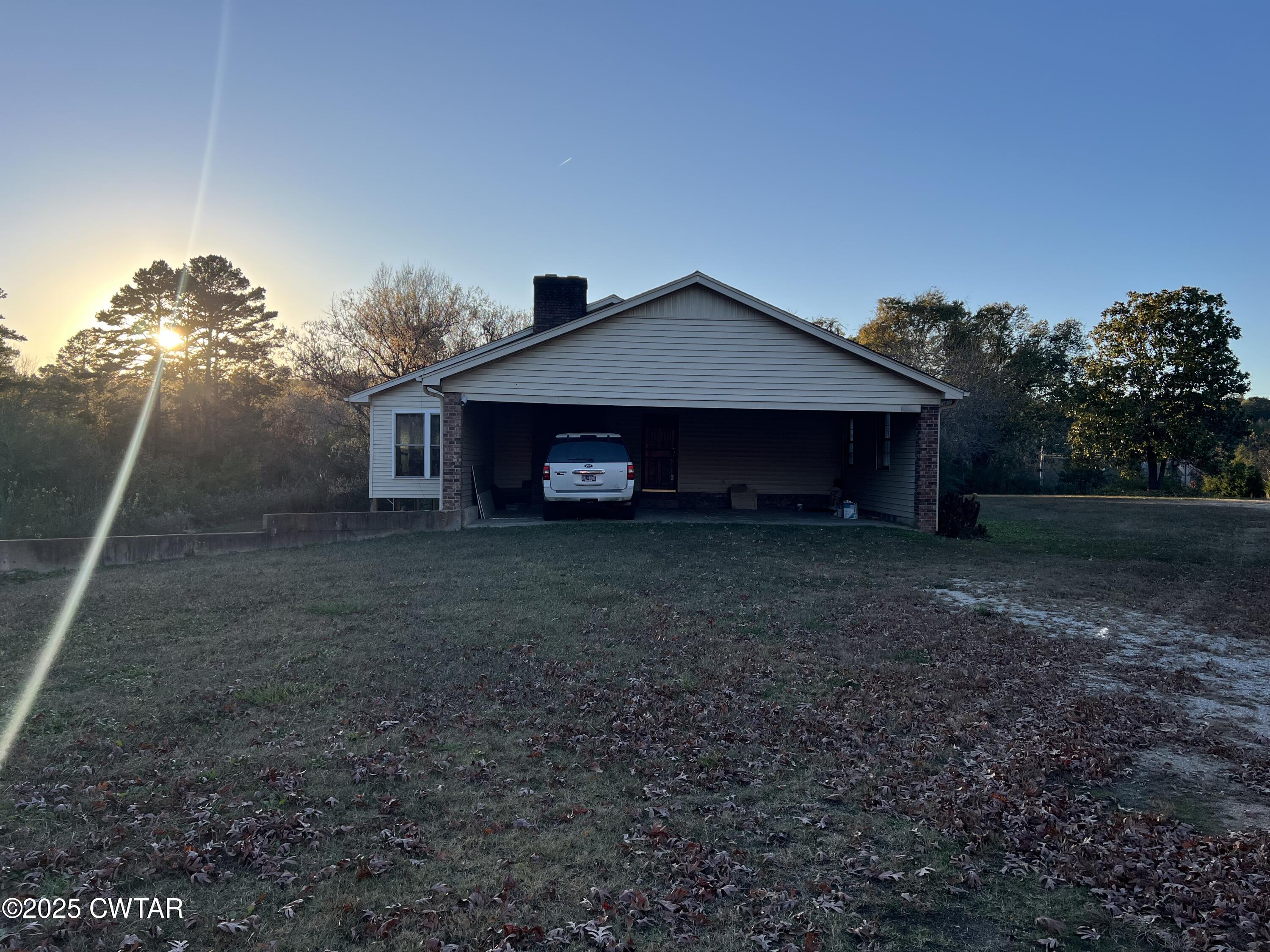 4335 Silerton Road Henderson, TN 38340 - Photo 24 of 24 a front view of a house with a yard