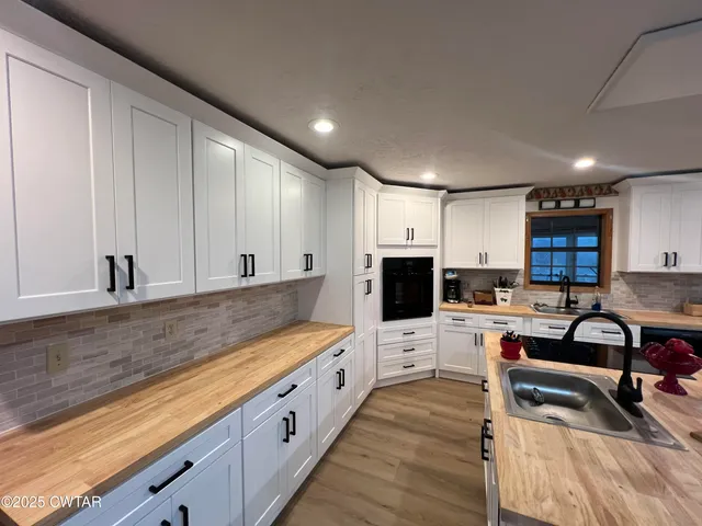 a large kitchen with cabinets