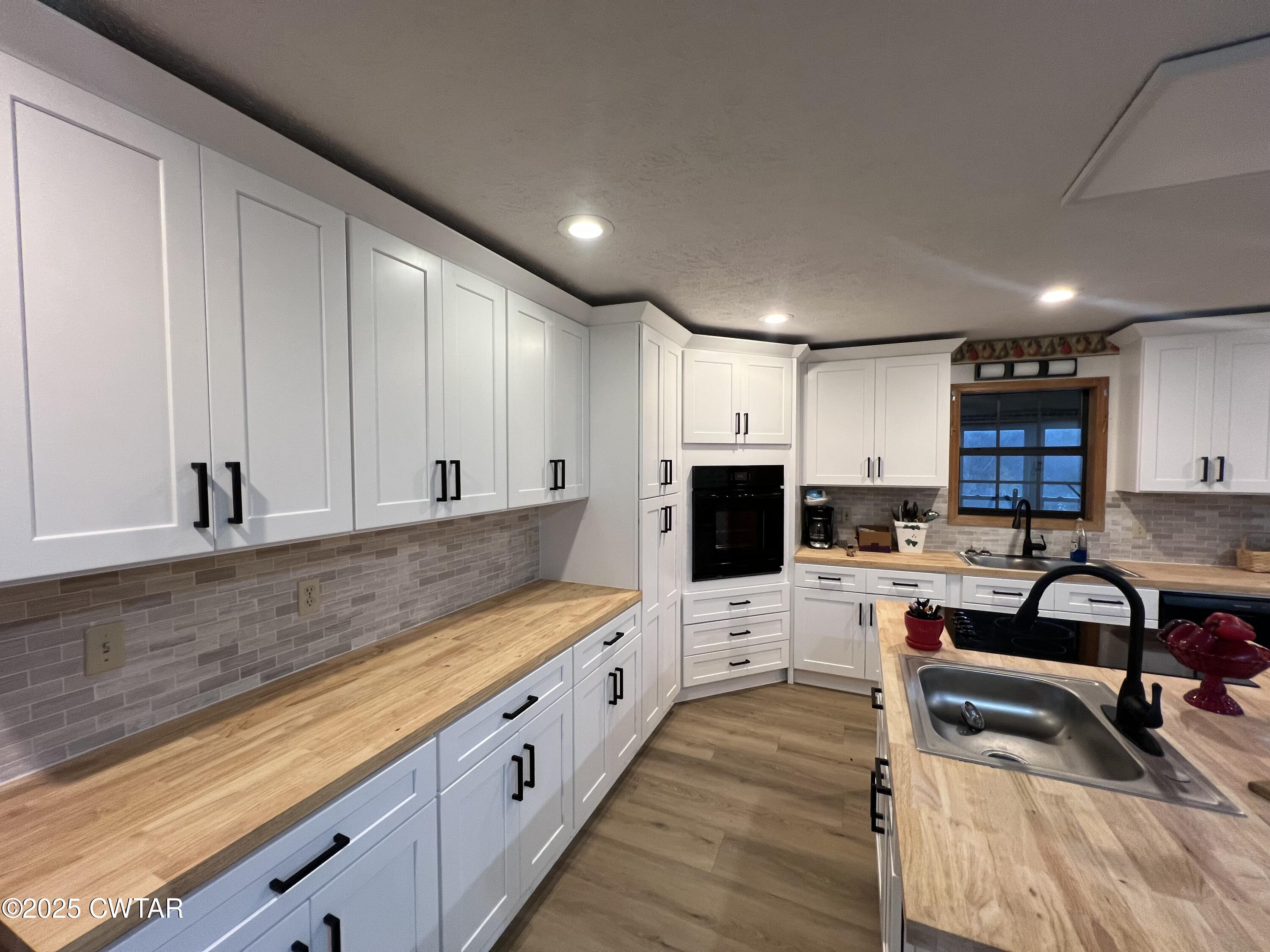 4335 Silerton Road Henderson, TN 38340 - Photo 5 of 24 a large kitchen with cabinets