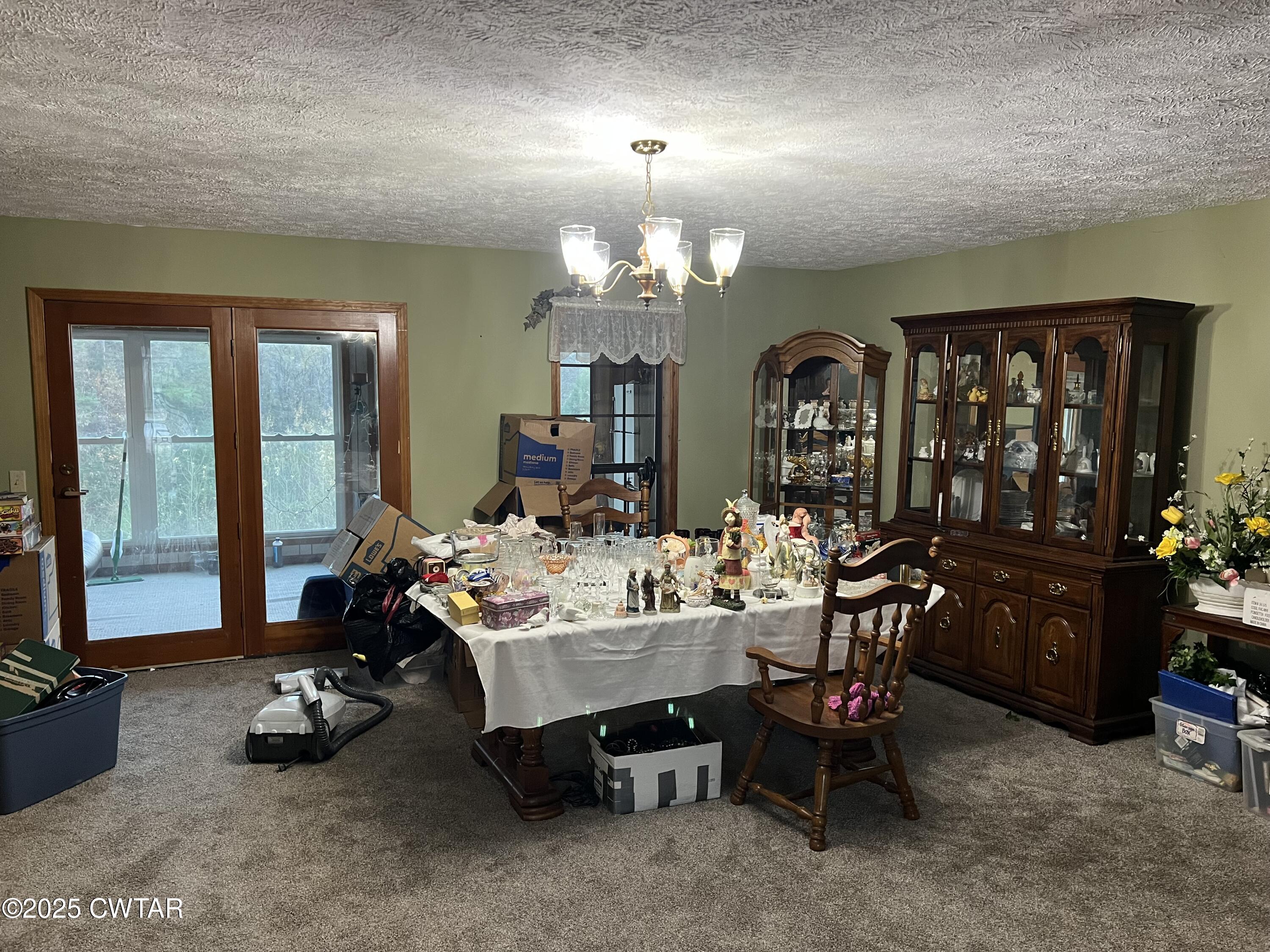 4335 Silerton Road Henderson, TN 38340 - Photo 6 of 24 a view of a livingroom with furniture and a chandelier