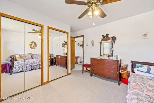 a bedroom with furniture and a chandelier