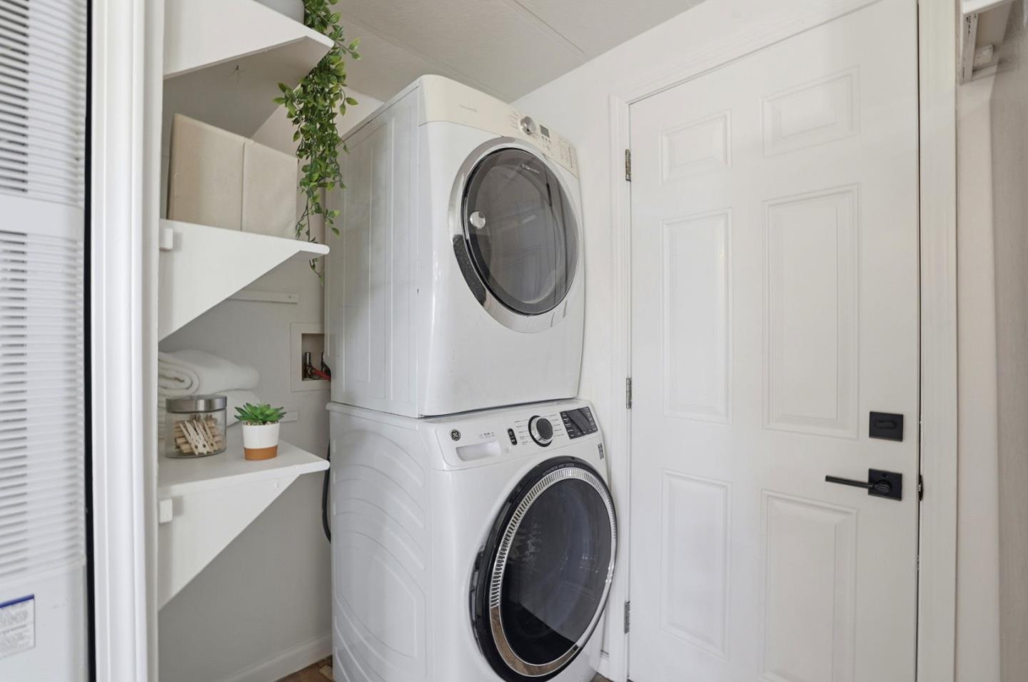555 Umbarger Road, Unit 31 San Jose, CA 95111 - Photo 14 of 18 a view of a hallway with washer and dryer
