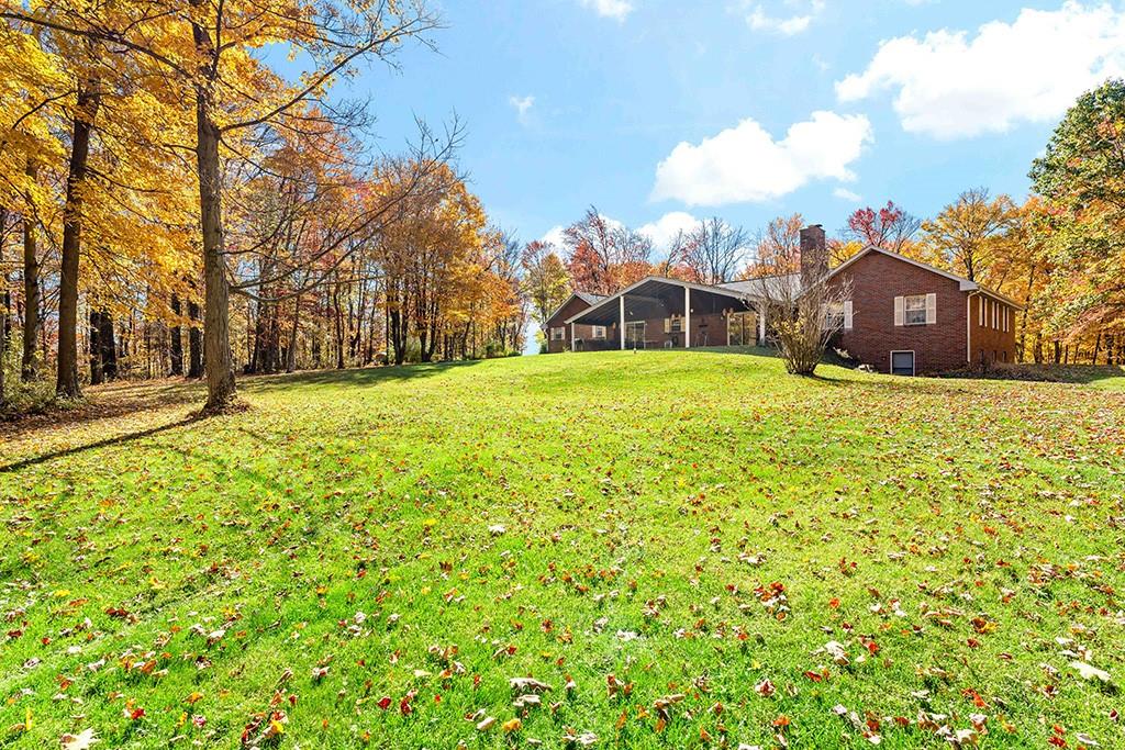 275 Swearingen Road Georgetown, PA 15043 - Photo 32 of 40 a view of a big yard with a house in the background