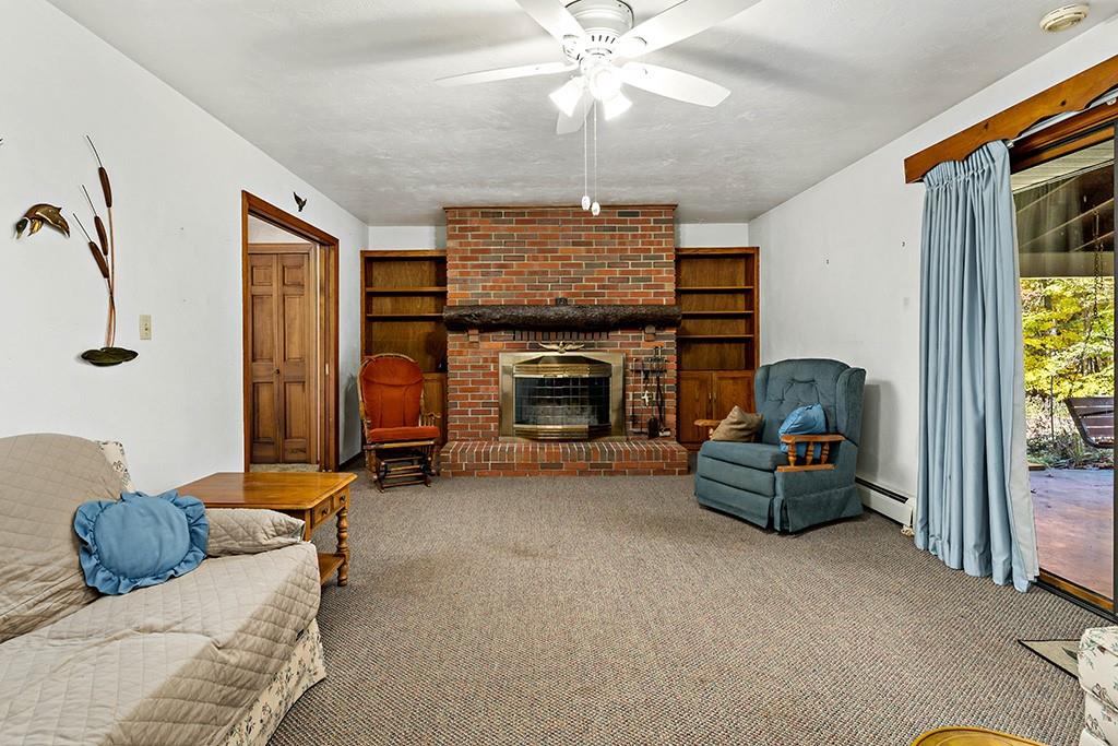 275 Swearingen Road Georgetown, PA 15043 - Photo 7 of 40 a living room with furniture and a fireplace