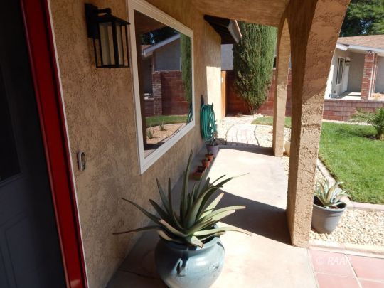 517 Suzanne Street Ridgecrest, CA 93555 - Photo 4 of 34 a view of potted plant in front of a door