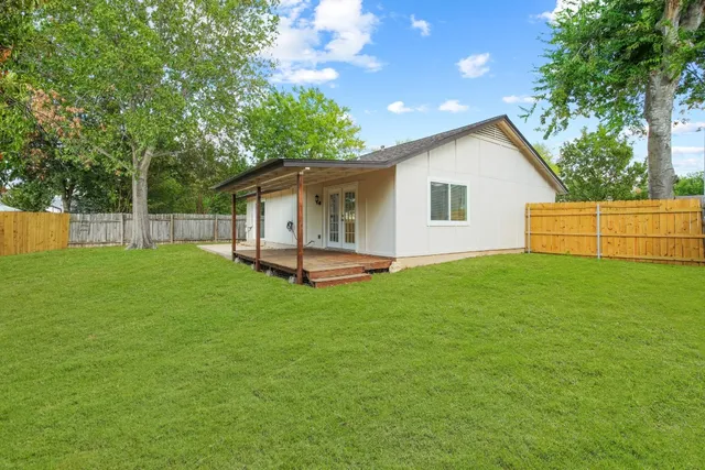 a view of a backyard with a garden and plants