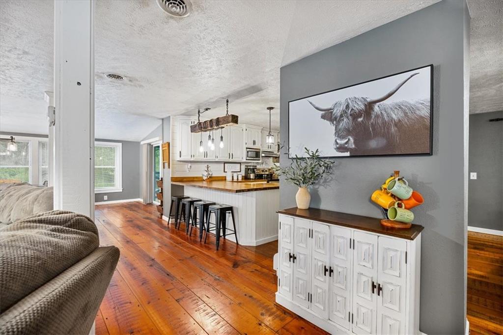 172 Queen Junction Road Butler, PA 16001 - Photo 11 of 38 a living room with furniture and wooden floor