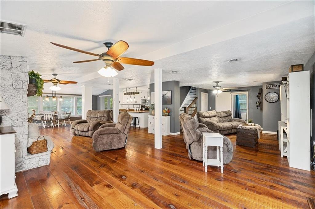 172 Queen Junction Road Butler, PA 16001 - Photo 12 of 38 a living room with fireplace furniture and a wooden floor