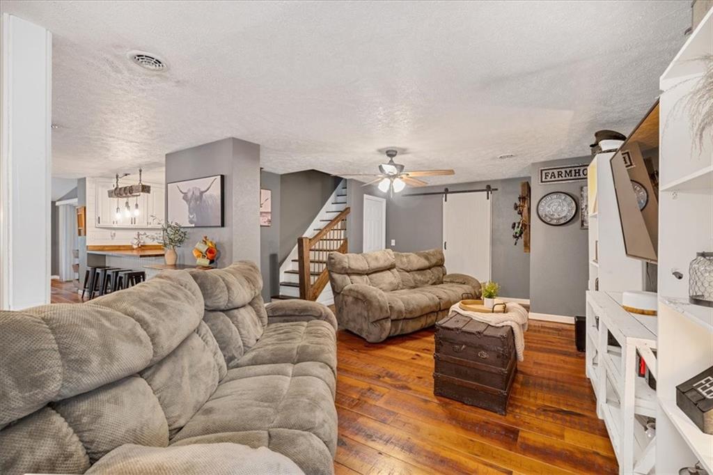 172 Queen Junction Road Butler, PA 16001 - Photo 13 of 38 a living room with furniture and a flat screen tv
