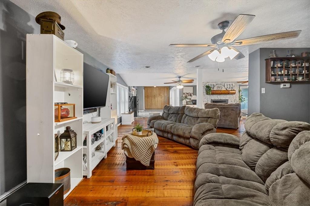 172 Queen Junction Road Butler, PA 16001 - Photo 14 of 38 a living room with furniture kitchen view and a flat screen tv