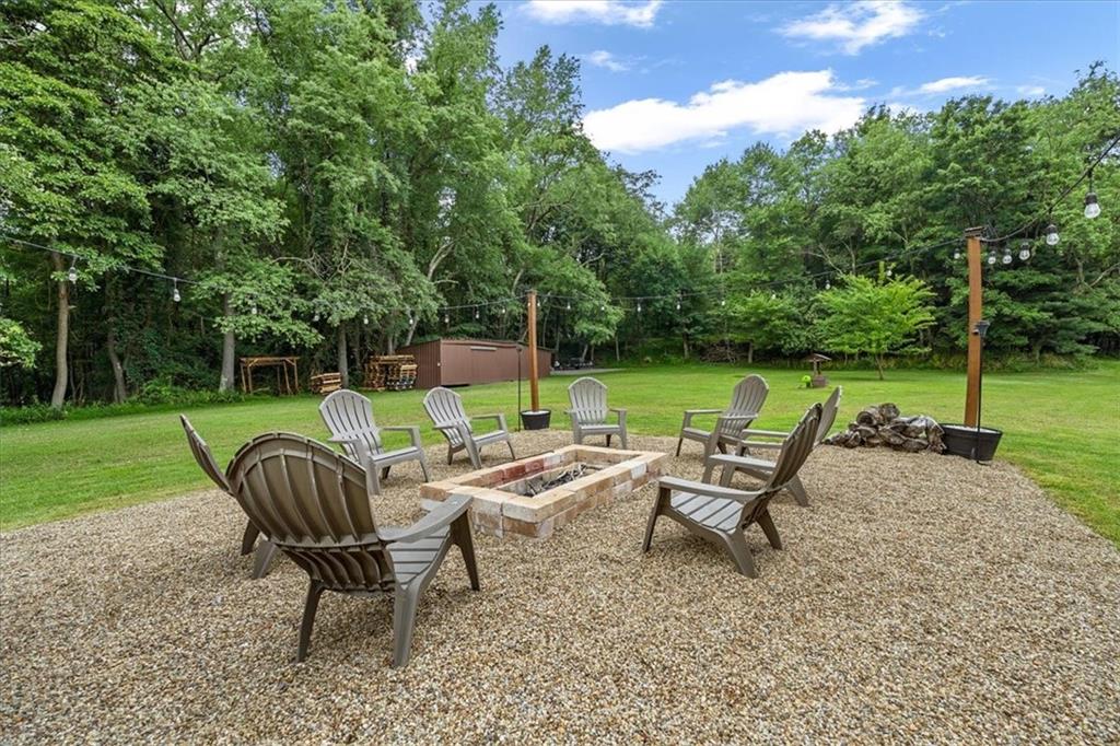 172 Queen Junction Road Butler, PA 16001 - Photo 28 of 38 a view of a chair and table in the back yard