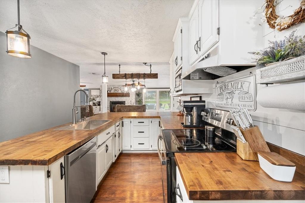 172 Queen Junction Road Butler, PA 16001 - Photo 7 of 38 a kitchen with stainless steel appliances granite countertop a sink and cabinets