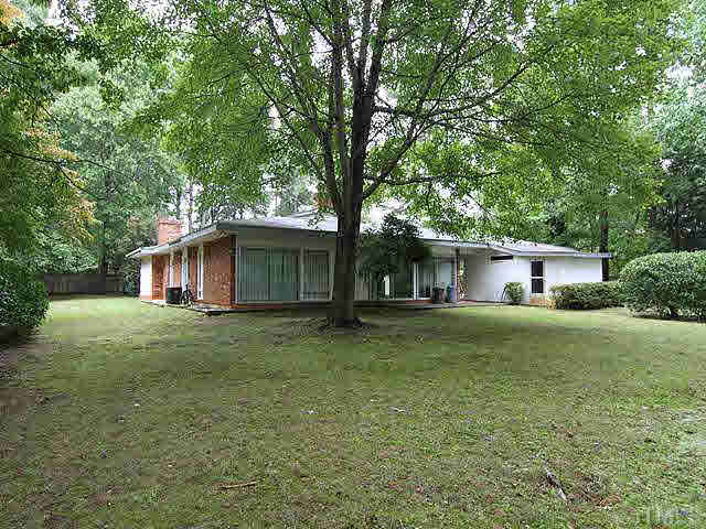 3205 Caldwell Drive Raleigh, NC 27607 - Photo 9 of 14 View from backyard of home. White attached building is 3 separate storage areas Exterior Back