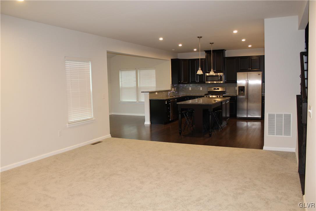 2584 Raya Way Easton, PA 18045 - Photo 12 of 35 a kitchen with stainless steel appliances a refrigerator and a microwave