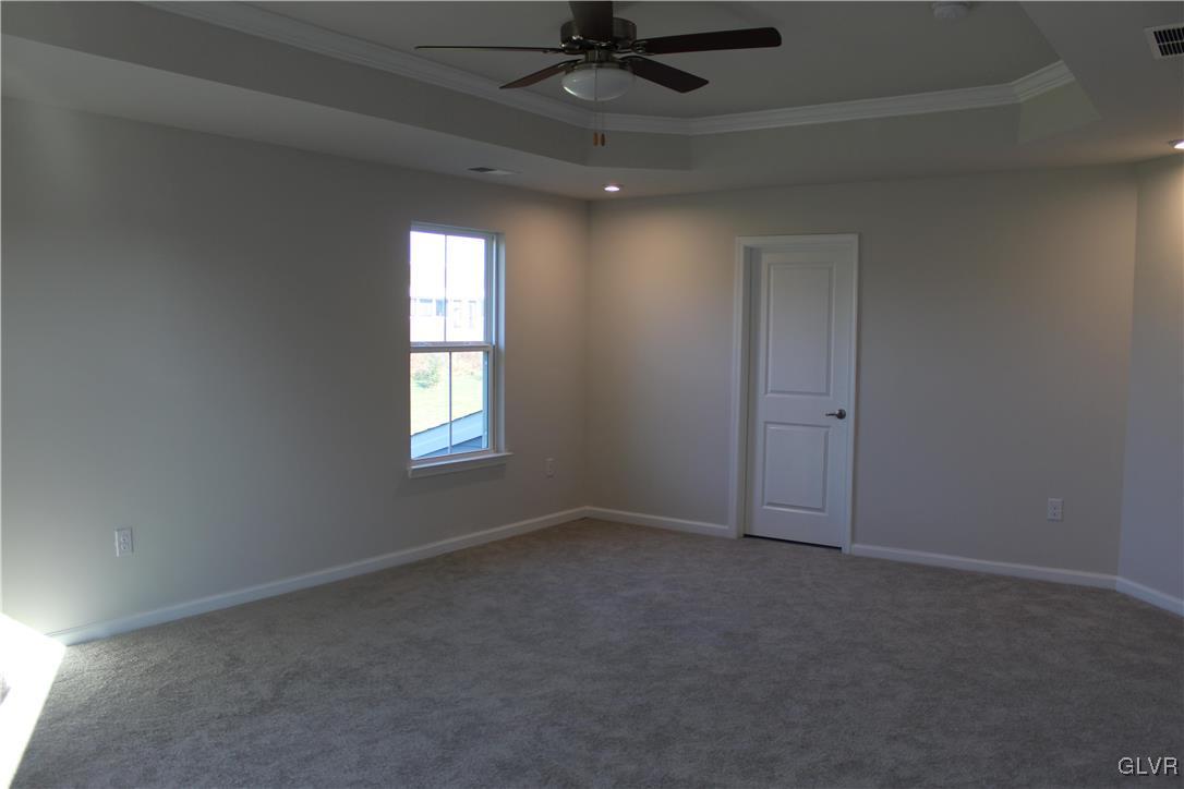 2584 Raya Way Easton, PA 18045 - Photo 27 of 35 an empty room with a ceiling fan and window