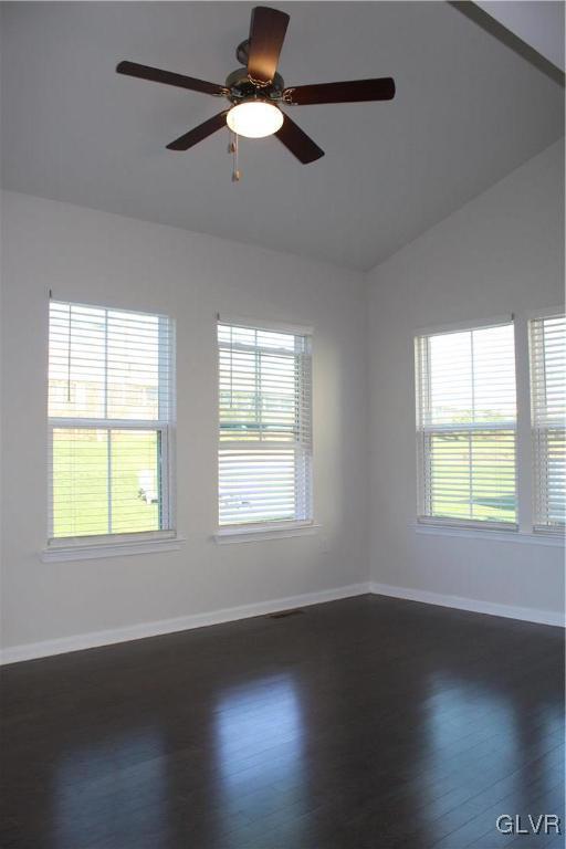 2584 Raya Way Easton, PA 18045 - Photo 9 of 35 an empty room with wooden floor chandelier fan and windows