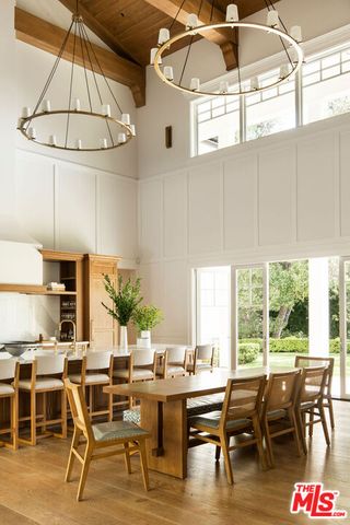 a bathroom with a granite countertop sink mirror and a bathtub