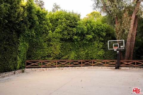 a view of fountain and a yard