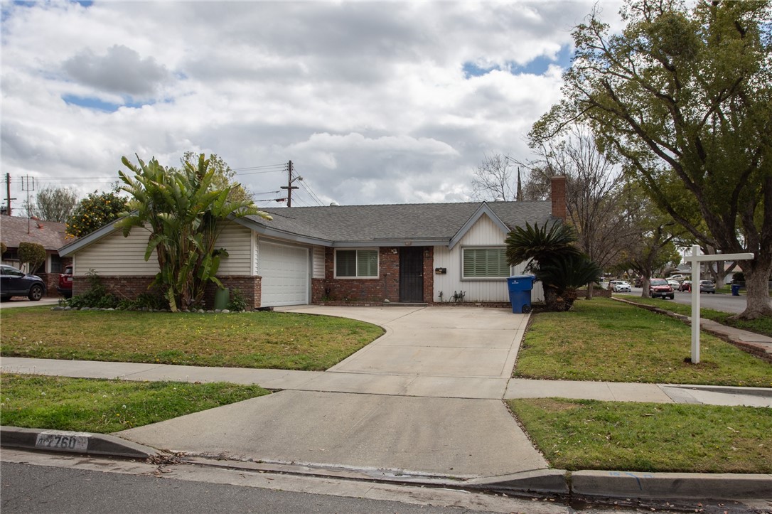 7760 Potomac Street Riverside, CA 92504 - Photo 1 of 1 a front view of a house with garden
