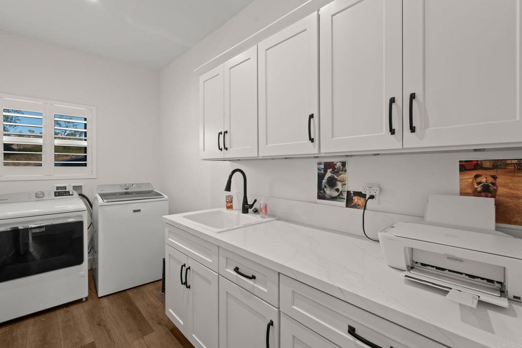 15663 Mathew Road Valley Center, CA 92082 - Photo 18 of 54 a view of a storage and utility room with washer and dryer