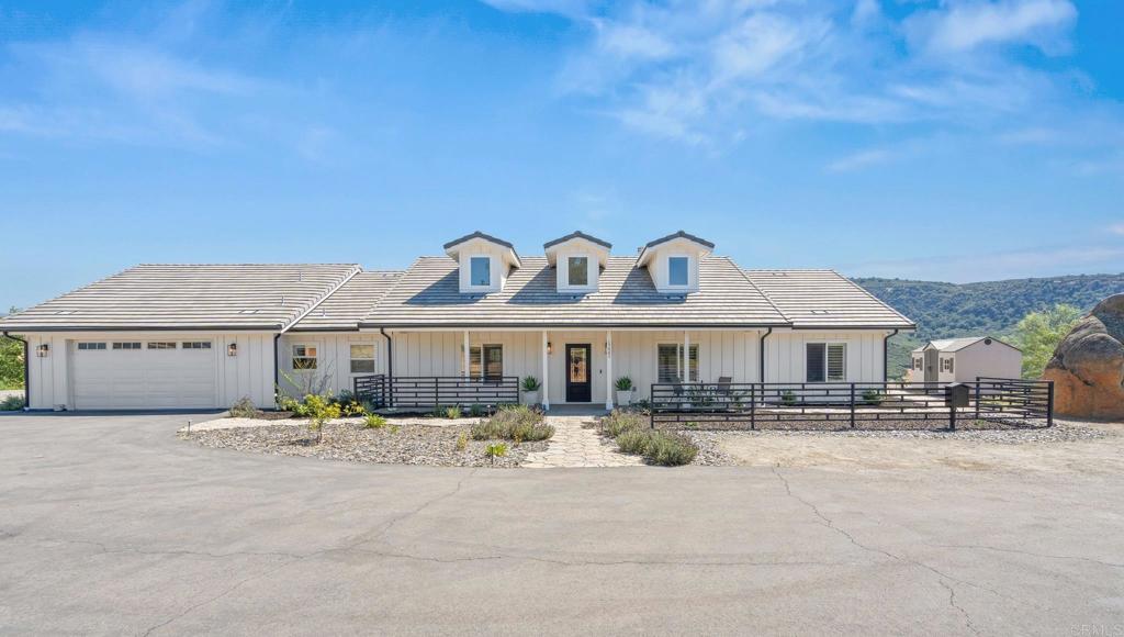 15663 Mathew Road Valley Center, CA 92082 - Photo 2 of 54 a front view of a house with a yard