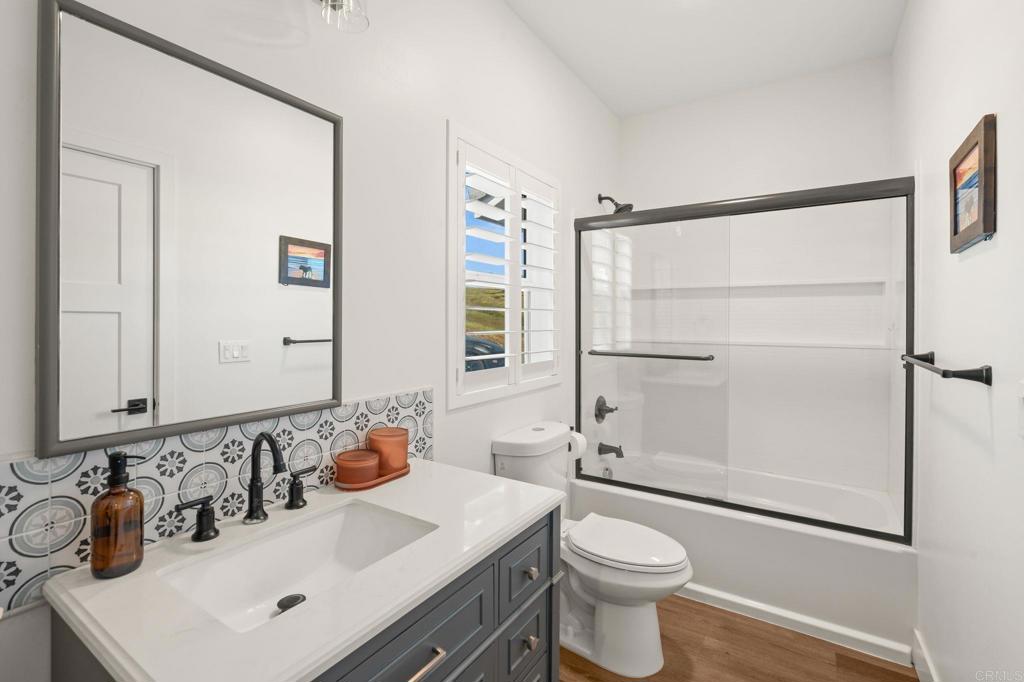 15663 Mathew Road Valley Center, CA 92082 - Photo 23 of 54 a bathroom with a sink toilet and shower