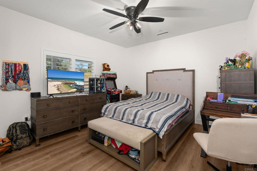 15663 Mathew Road Valley Center, CA 92082 - Photo 24 of 54 a bedroom with furniture and a bed
