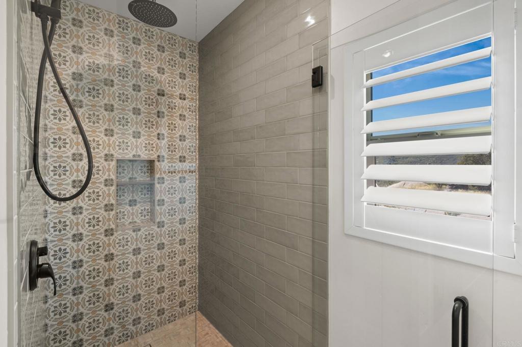 15663 Mathew Road Valley Center, CA 92082 - Photo 33 of 54 a bathroom with a shower and a sink