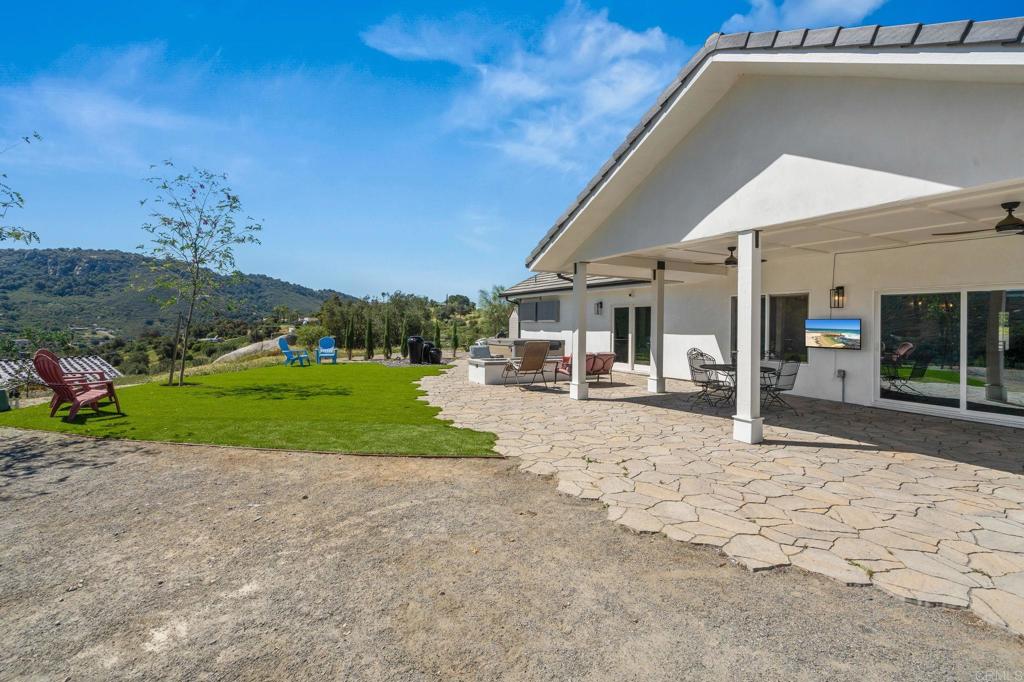 15663 Mathew Road Valley Center, CA 92082 - Photo 37 of 54 a view of a house with backyard and tree