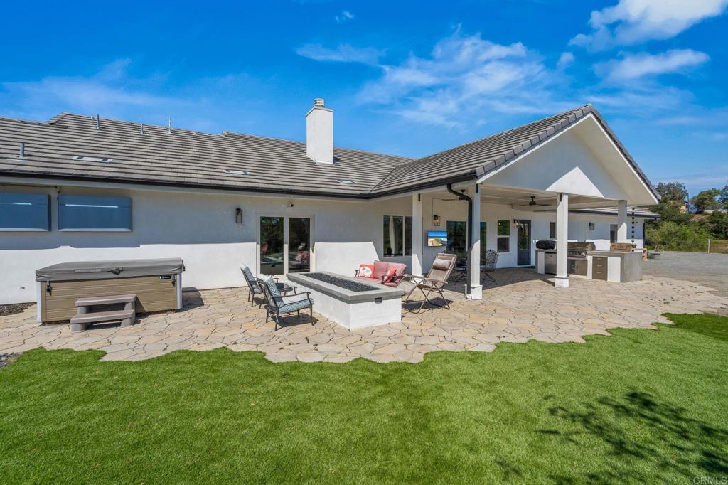 15663 Mathew Road Valley Center, CA 92082 - Photo 38 of 54 a view of a house with backyard and sitting area