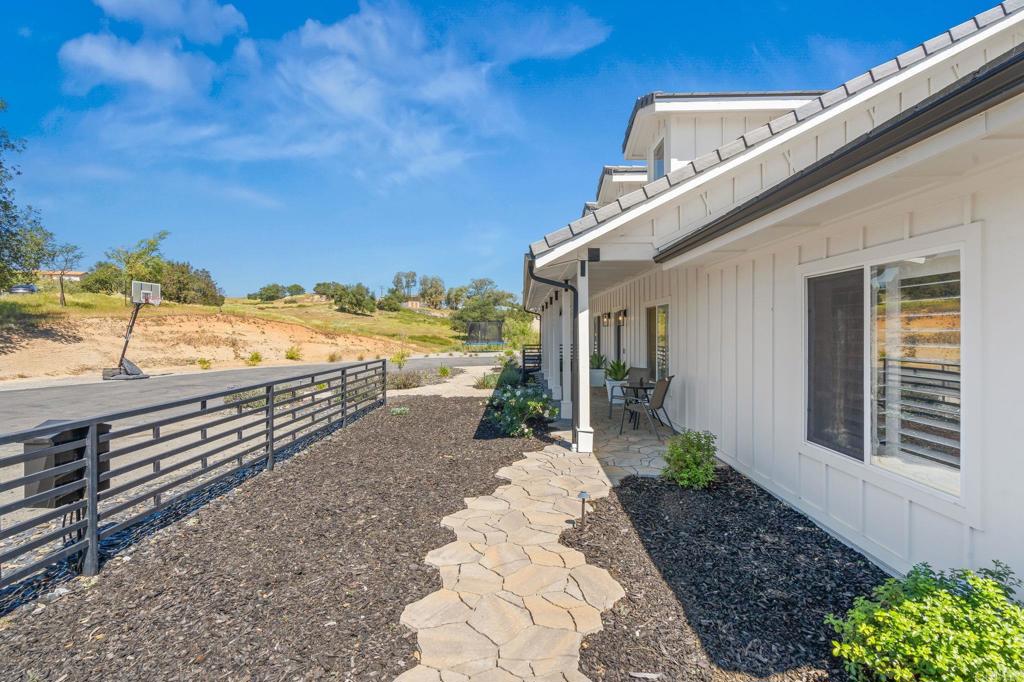 15663 Mathew Road Valley Center, CA 92082 - Photo 40 of 54 a view of a terrace with chairs and a table