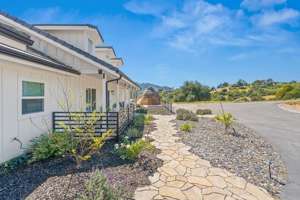 15663 Mathew Road Valley Center, CA 92082 - Photo 42 of 54 a front view of a house with garden
