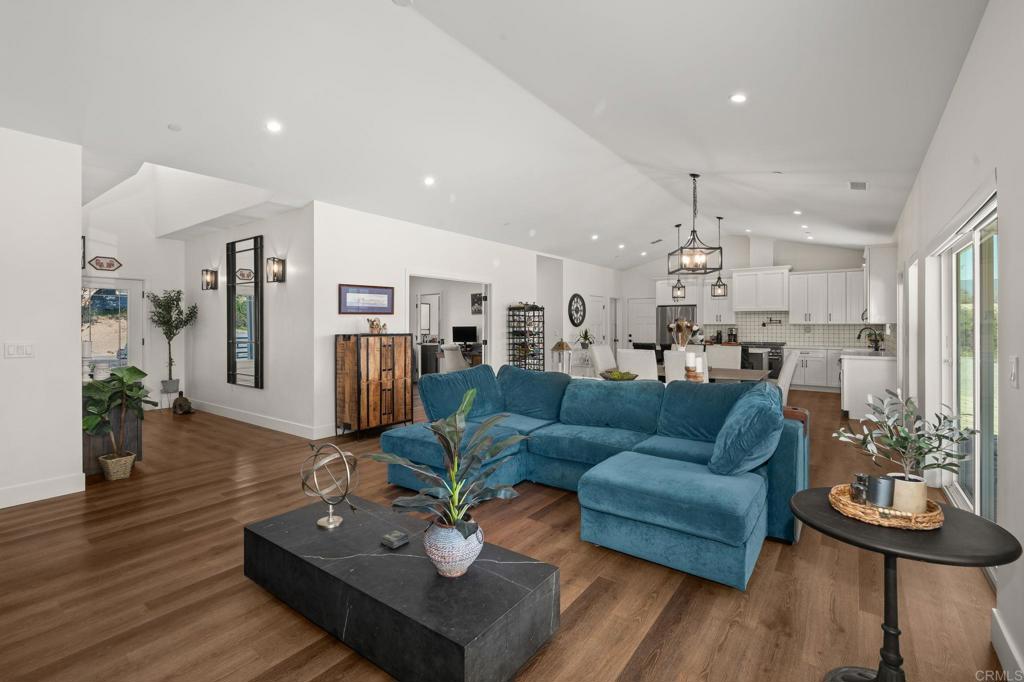 15663 Mathew Road Valley Center, CA 92082 - Photo 5 of 54 a living room with furniture and wooden floor